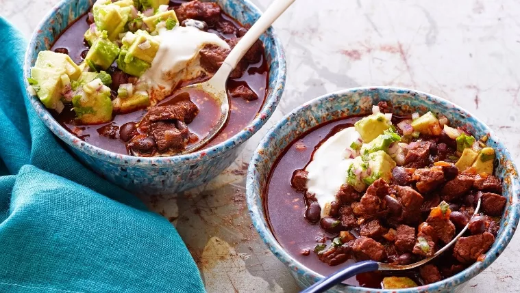Beef and Black Bean Chilli with Cumin Crema Recipe | Food Network UK