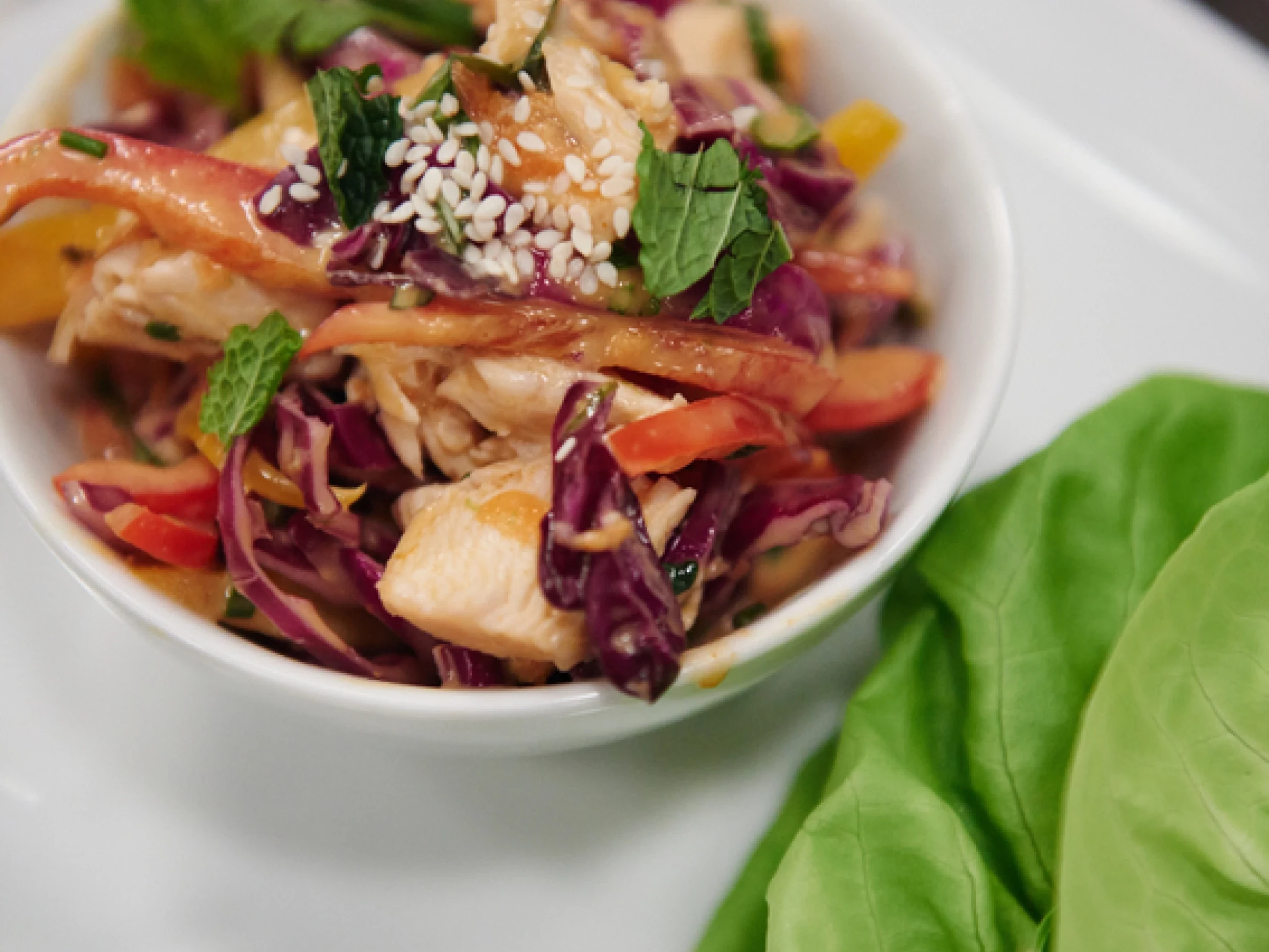 Satay chicken salad wraps