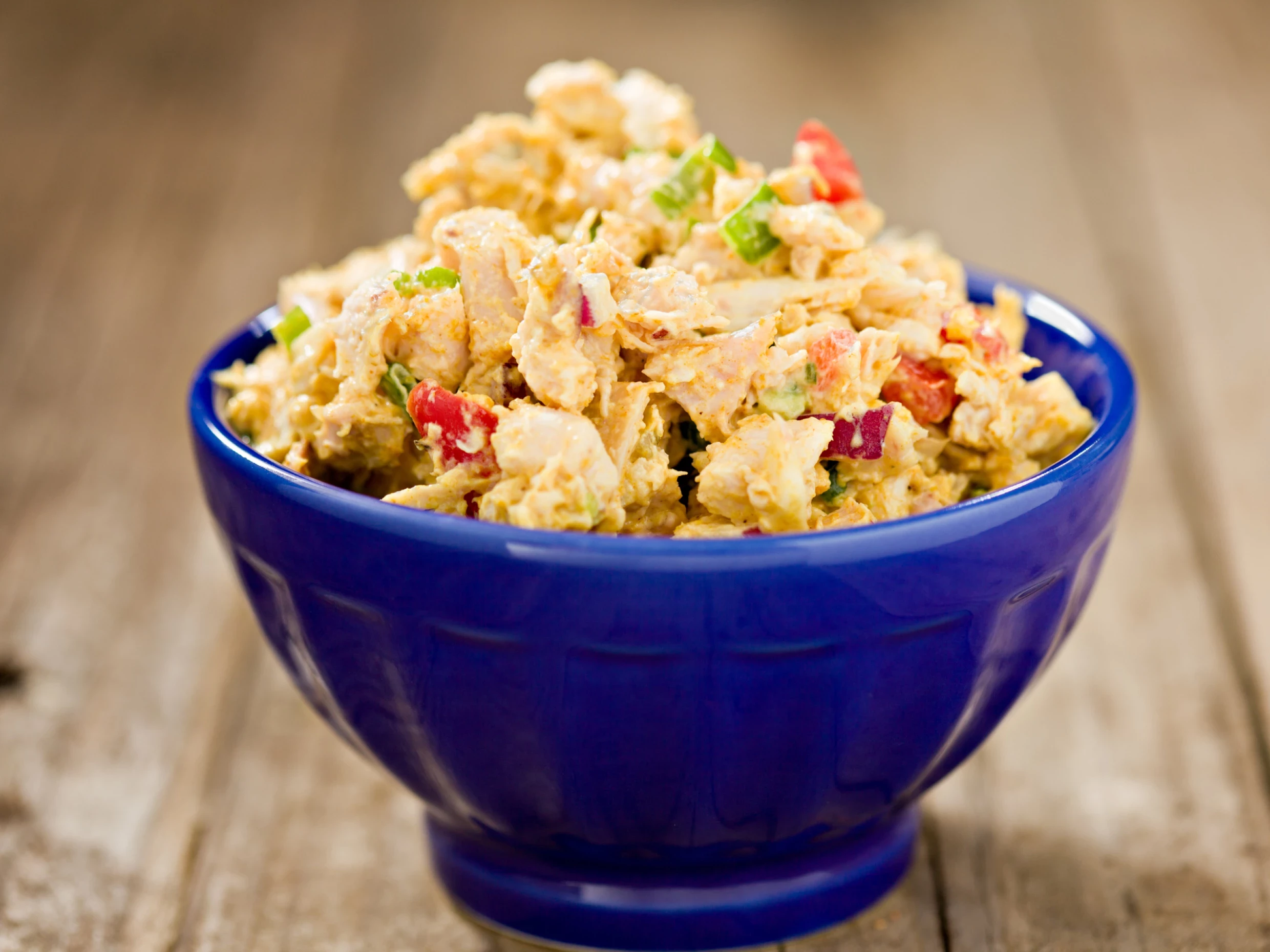 a bowl of curried chicken salad