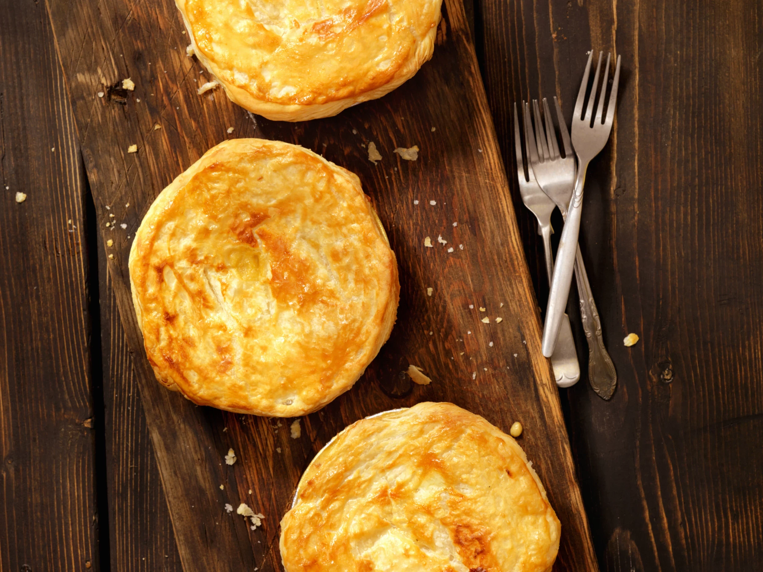 a puff pastry dome holding a mushroom bisque
