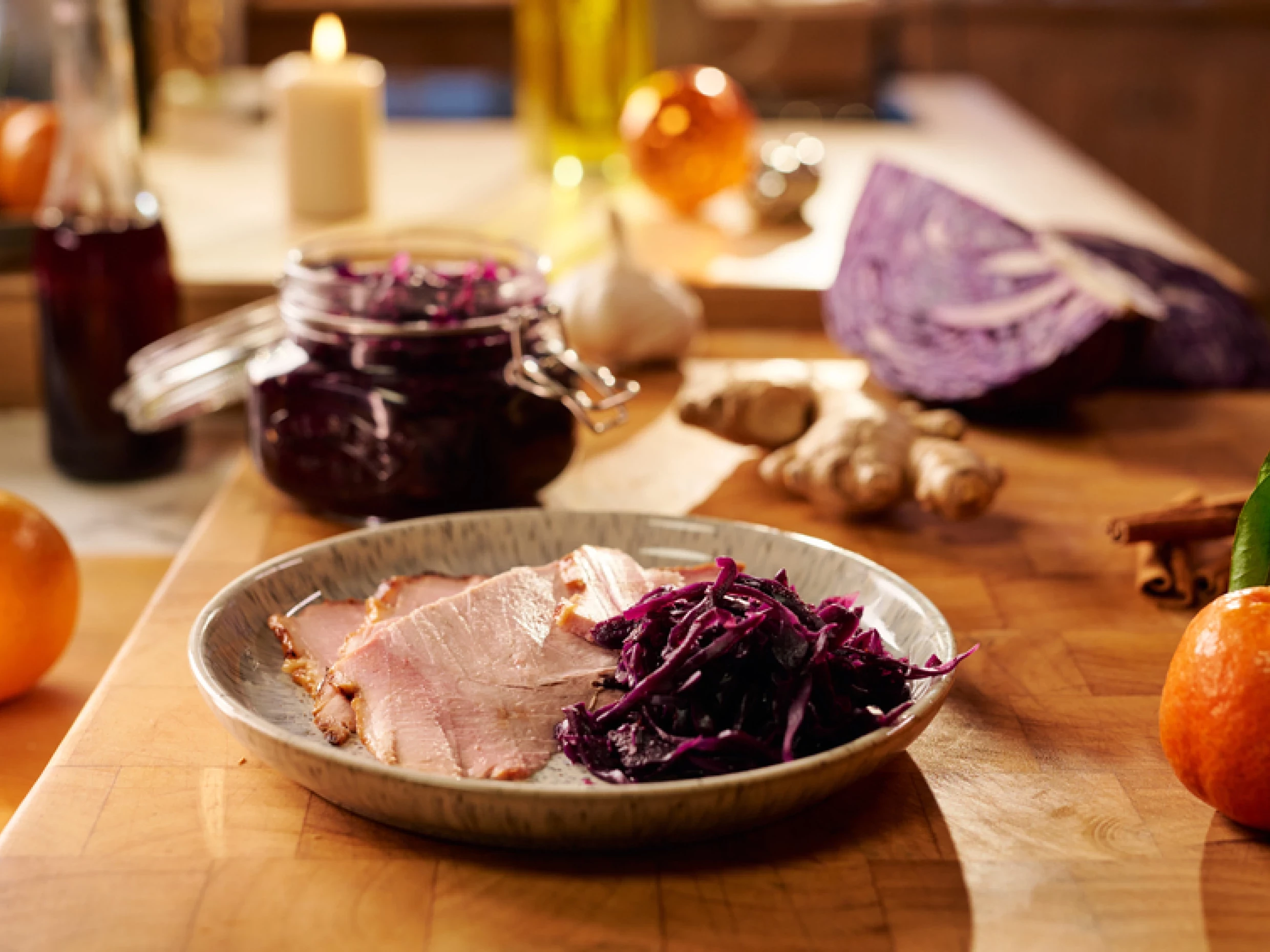 Marcus Wareing's Christmas Cabbage on a plate beside slices of roasted ham