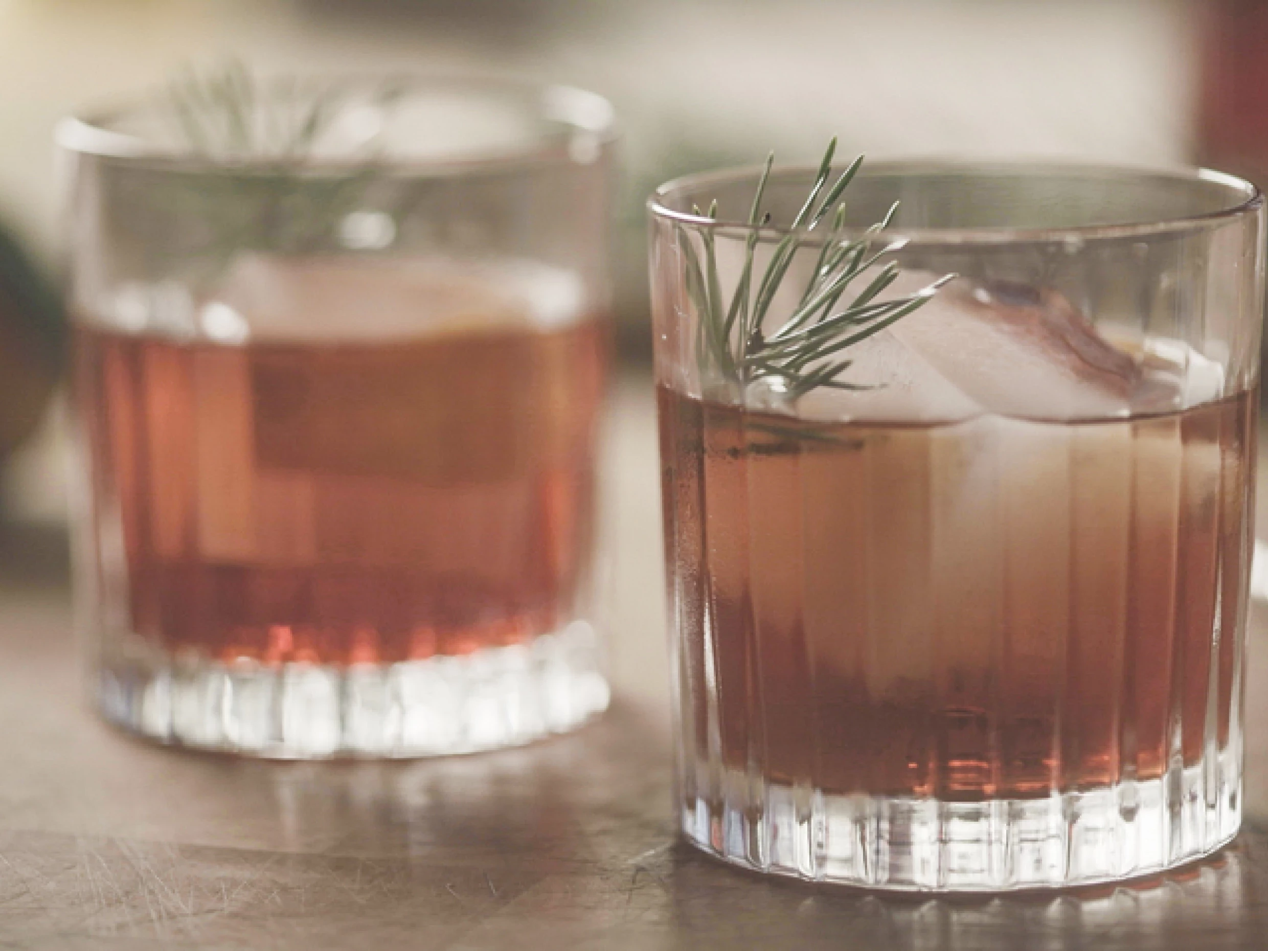 A negroni cocktail with a garnish.
