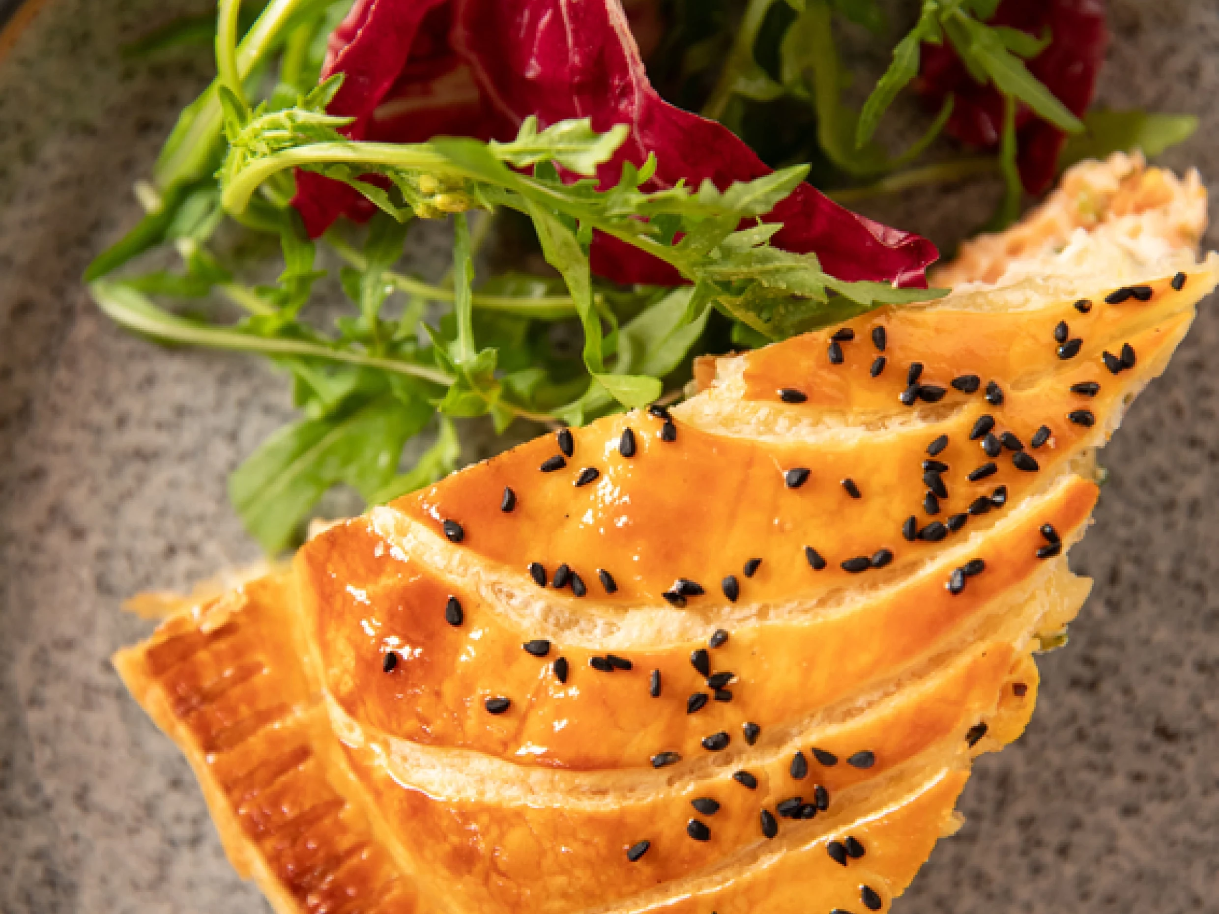 Salmon Pithivier with spring onions, chives and dill