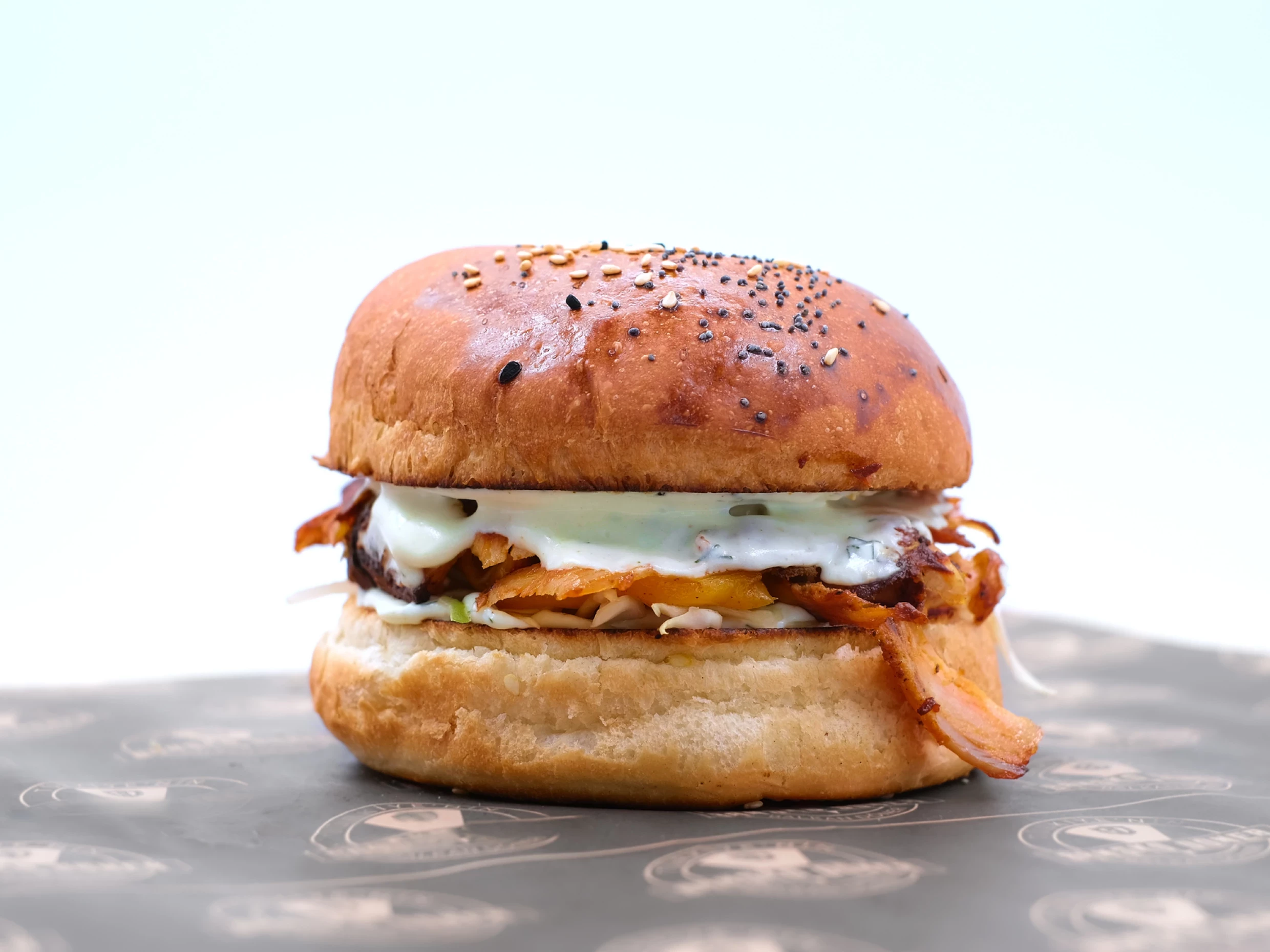 Alabama Smokehouse pig burger with white barbecue sauce