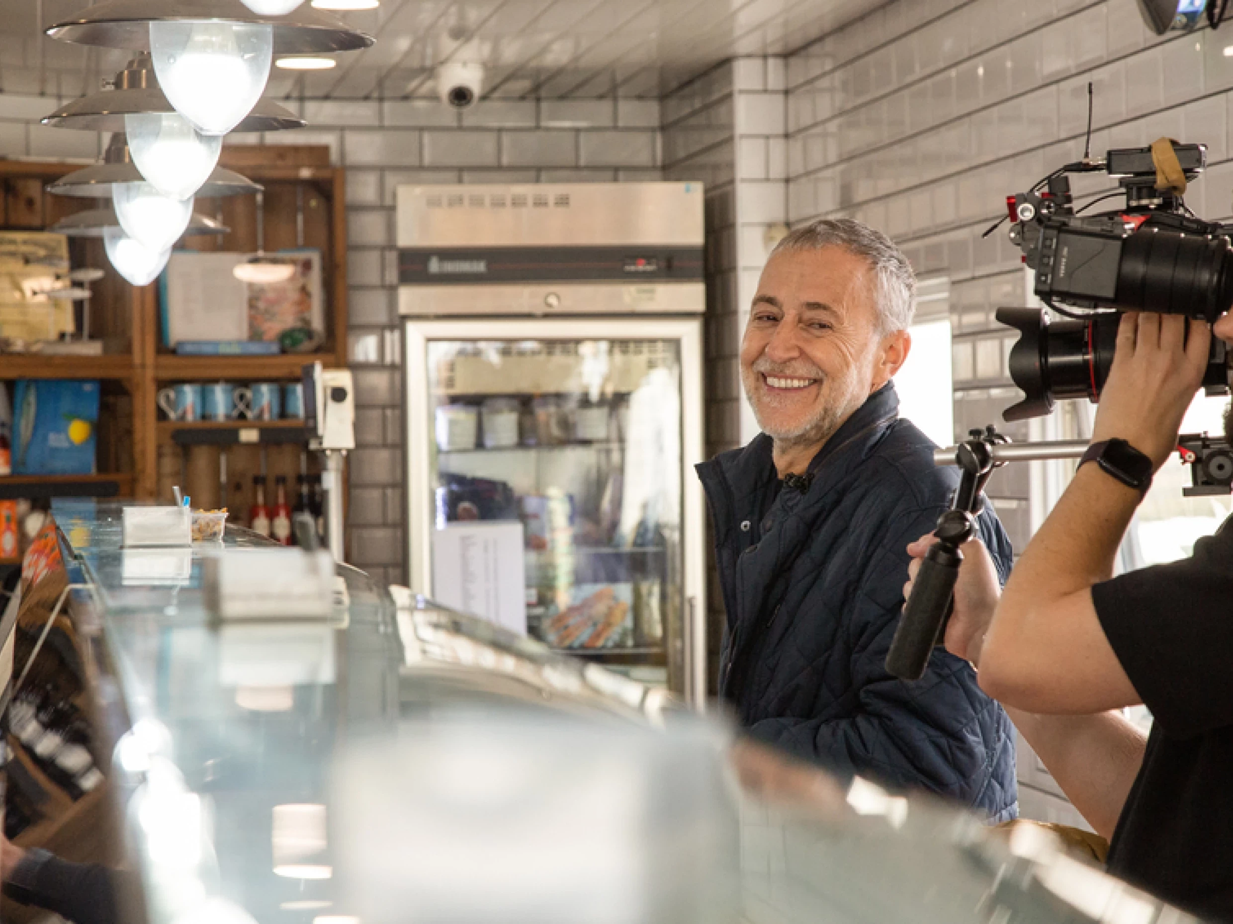 Michel Roux Jr at Osborne's Fishmongers in Leigh-On-Sea with camera crew