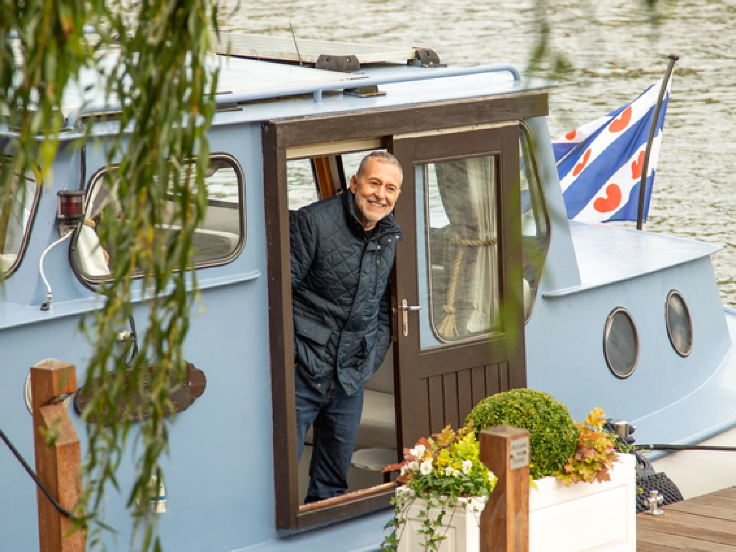 Michel Roux Jnr looking out from boat outside The Waterside Inn on the river