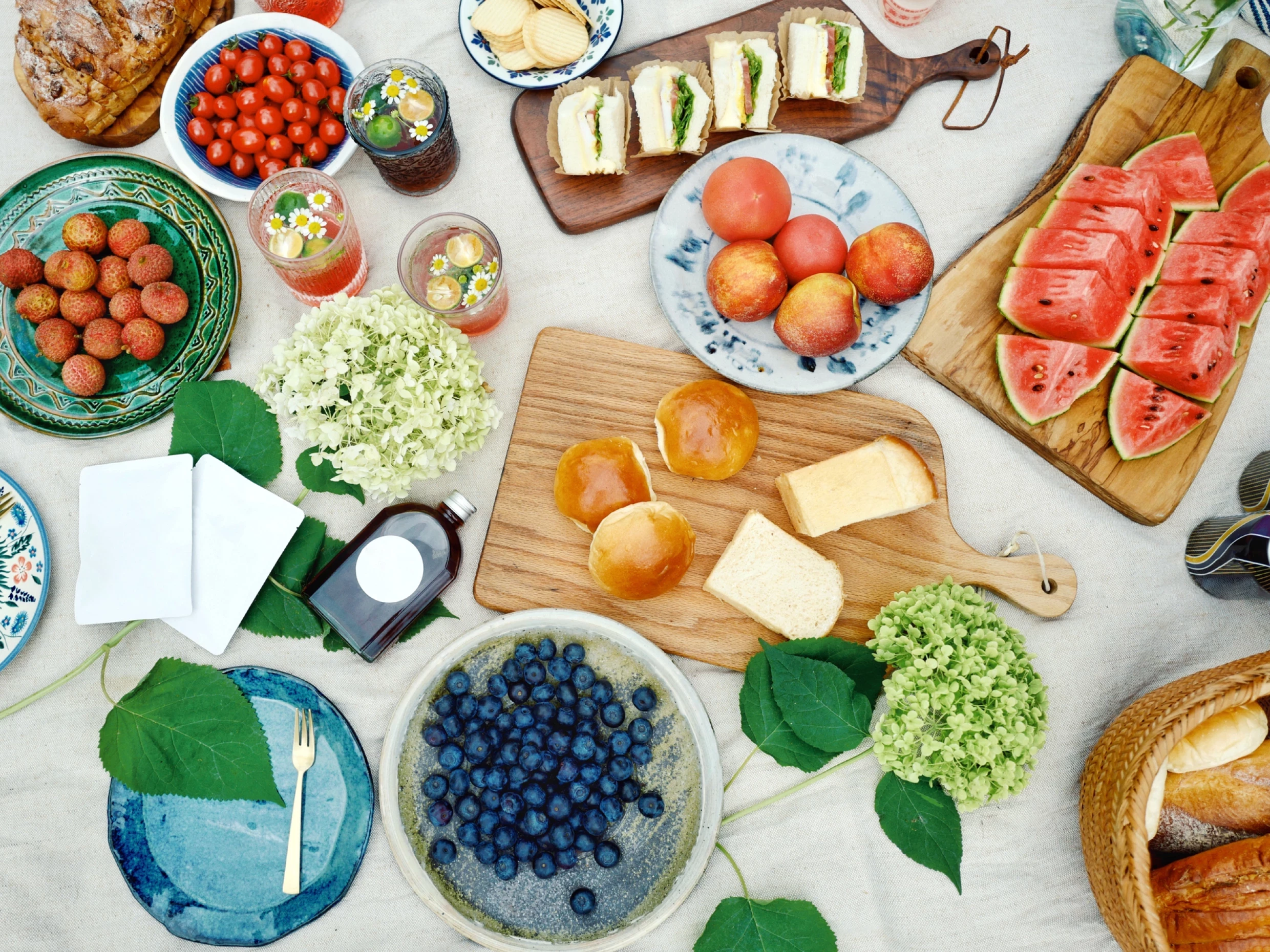 Summer picnic on blanket with food and fruit