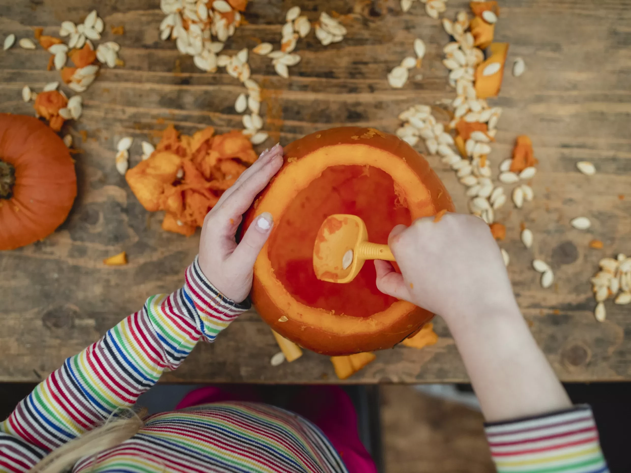 scooping out pumpkin